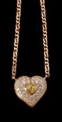 A diamond and yellow diamond heart pendant