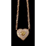 A diamond and yellow diamond heart pendant