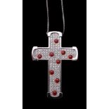 A diamond and coral cross pendant