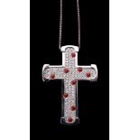 A diamond and coral cross pendant