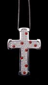 A diamond and coral cross pendant