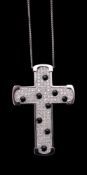 A diamond and onyx cross pendant