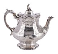 ϒ A Victorian silver panelled baluster tea pot by the Barnard Bros
