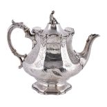 ϒ A Victorian silver panelled baluster tea pot by the Barnard Bros