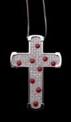 A diamond and coral cross pendant