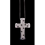 A diamond and onyx cross pendant