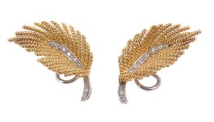 A pair of gold coloured diamond ear clips