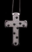 A diamond and onyx cross pendant