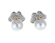 A pair of diamond and South Sea cultured pearl earrings