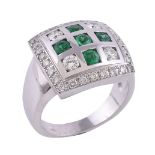 An emerald and diamond ring