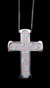 A diamond and turquoise cross pendant