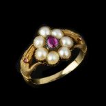 A half pearl and ruby ring