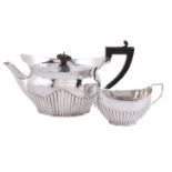 A late Victorian silver navette shape tea pot by The Goldsmiths & Silversmiths Co. Ltd