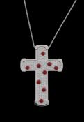 ϒ A diamond and coral cross pendant