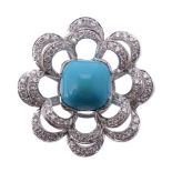 A turquoise and diamond flower head ring