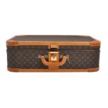 Louis Vuitton, a coated monogrammed canvas suitcase