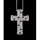 A diamond and onyx cross pendant