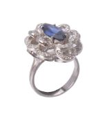 A sapphire and diamond flowerhead cluster dress ring