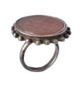 A Persian style cornelian seal and silver ring