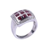 A ruby and diamond panel ring