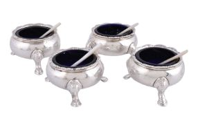 ϒ A set of four George II silver cauldron salt cellars by James Smith I