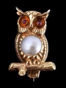 An 18 carat gold mabé pearl and ruby owl brooch