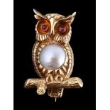 An 18 carat gold mabé pearl and ruby owl brooch