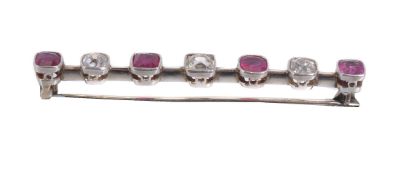 A ruby and diamond bar brooch