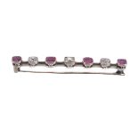 A ruby and diamond bar brooch