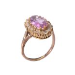 A pink topaz and diamond cluster ring
