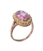 A pink topaz and diamond cluster ring