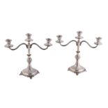 A pair of Italian silver coloured three light candelabra by Piero Arioli