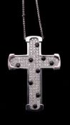 A diamond and onyx cross pendant