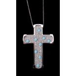 A diamond and turquoise cross pendant