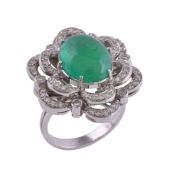 An emerald and diamond ring