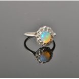 An opal and diamond cluster ring