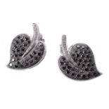 A pair of black diamond and diamond ear clips