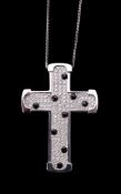 A diamond and onyx cross pendant