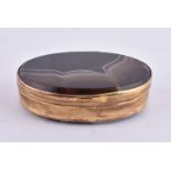 A gilt metal and banded agate oval box