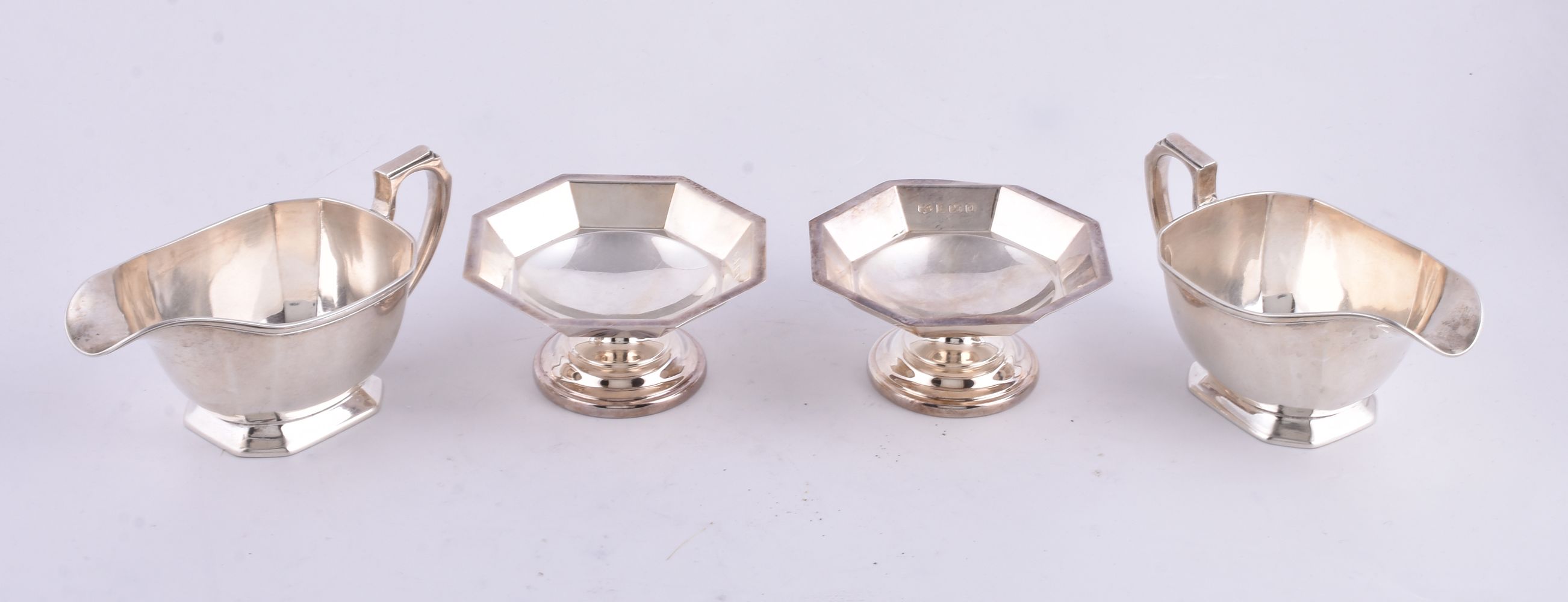 A pair of silver canted-rectangular sauce boats by Harrods Ltd