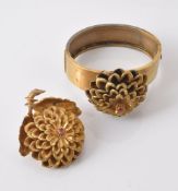 A flower brooch and bangle