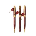 Parker, Sonnet, an amber Chinese lacque roller ball pen, ball point pen and propelling pencil