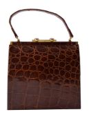 ϒ A brown crocodile leather handbag