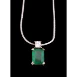 An emerald and diamond pendant