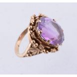 An amethyst single stone ring