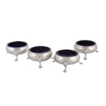 A set of four late George III silver cauldron salt cellars by Stephen Adams II