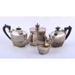 Two similar silver oval half reeded tea pots and a cream jug