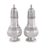 A pair of silver octagonal baluster sugar casters by W. I. Broadway & Co.