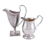 A silver helmet shape cream jug by Florence Warden