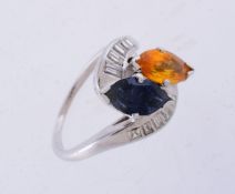 A sapphire, orange sapphire and diamond ring